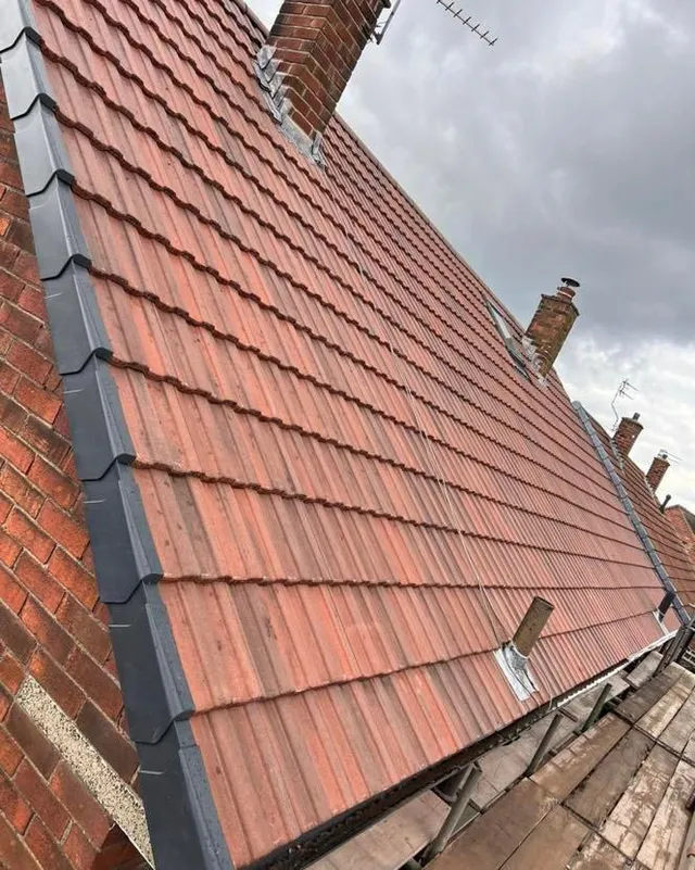 Red clay tiles laid to a pitched roof