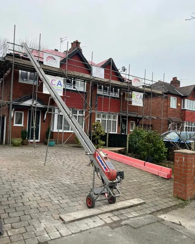 Tile hoist set up for a re-roof on a semi