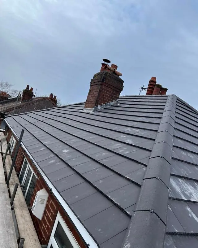 New grey tiles with chimney detailing