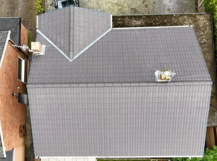 P Douglas Roofing & Building van outside a completed re-roof in Stockport